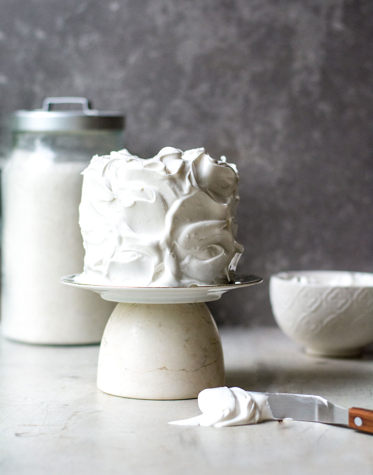 frosted meringue cake before toasting