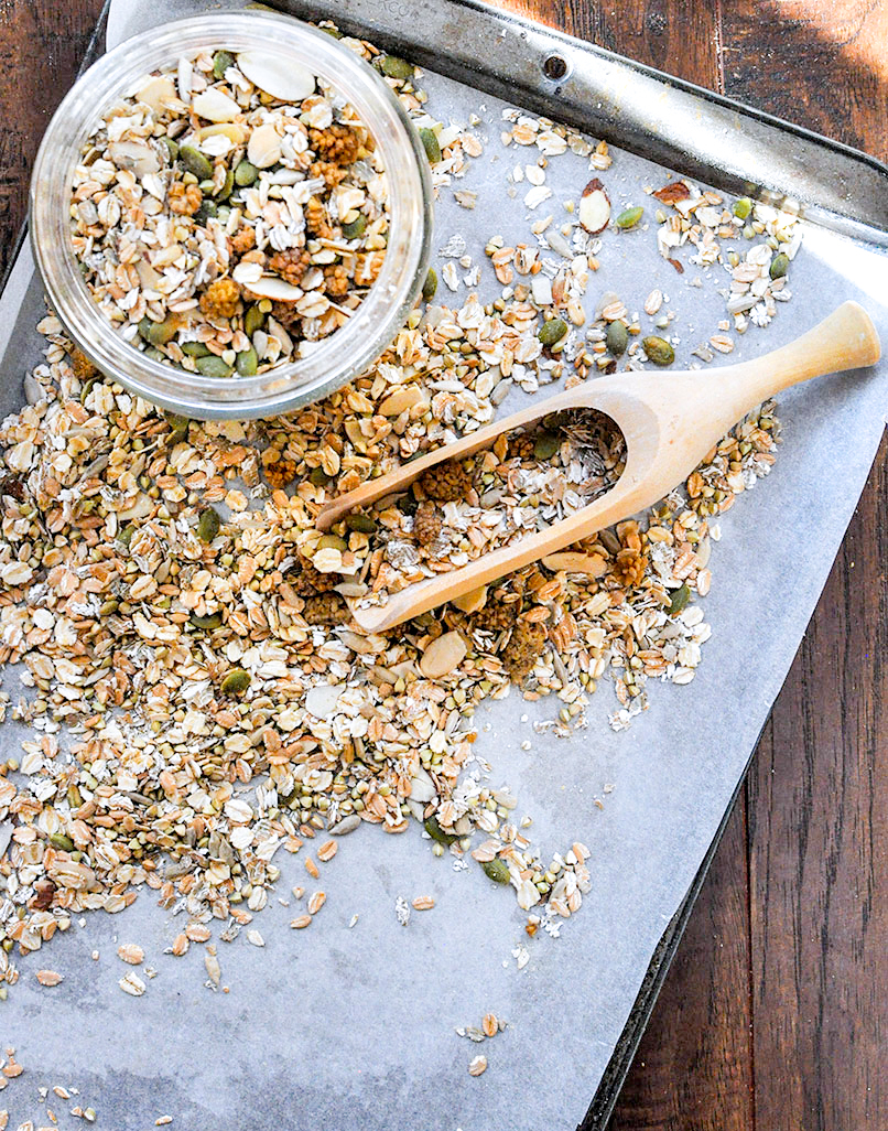 muesli on a baking sheet with scoop