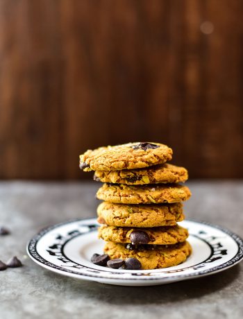 side view of a stack of 6 cookies on a white plate with animal designs