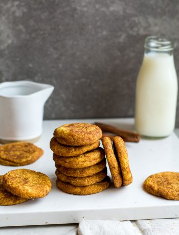 Stack of cookies with milk in background
